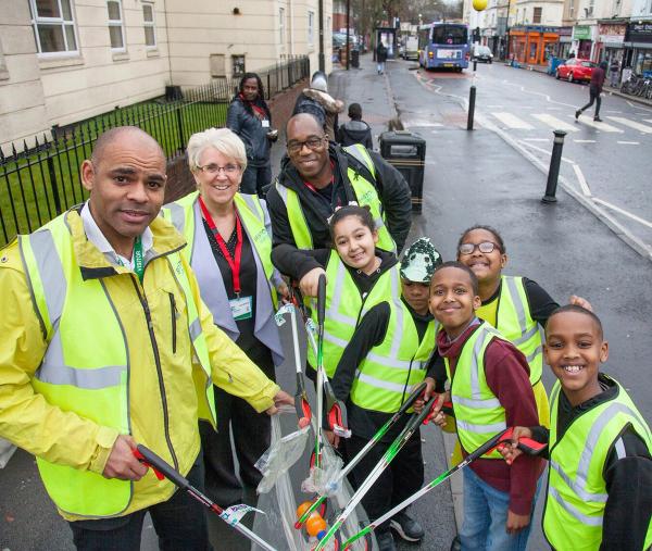 Marvin Rees on Stapleton Road with children from Hannah More Primary School, plus Tracey Morgan, CEO of Bristol Waste and Kurt James, Bristol Clean Streets lead officer