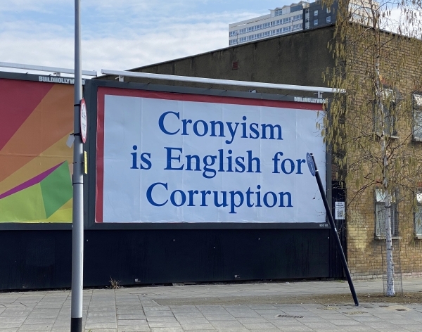 Billboard reads Cronysim is English for Corruption