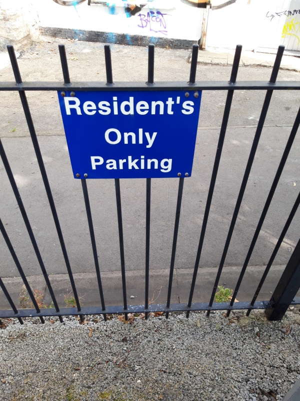 Notice reads Resident's Only Parking 
