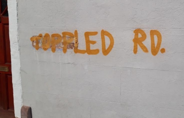 Colston Road sign over-sprayed with Toppled Rd.