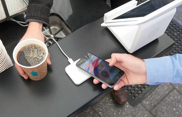 Paying for a coffee with an iPhone and Apple Pay