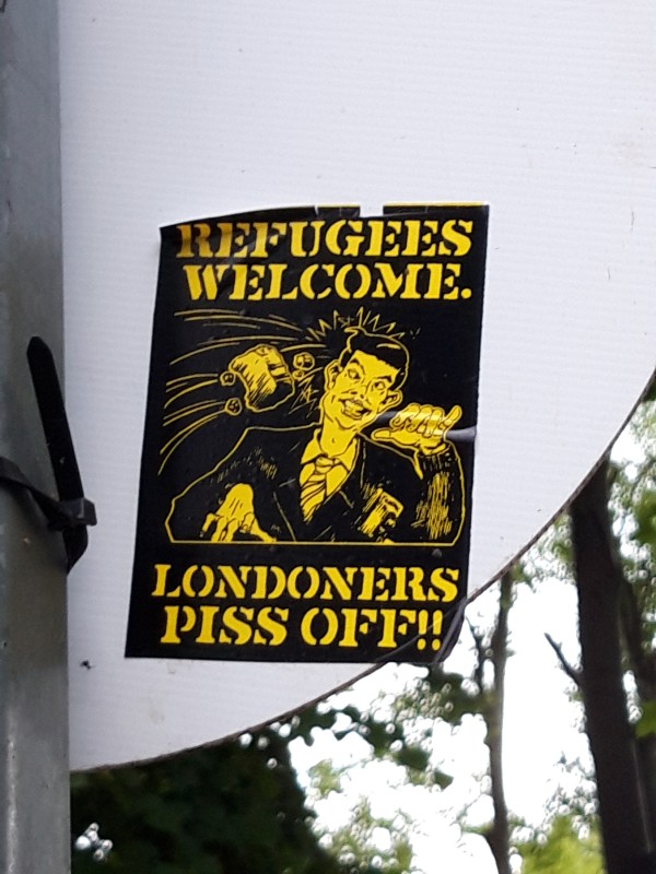 Sticker with wording Refugees welcome. Londoners piss off!