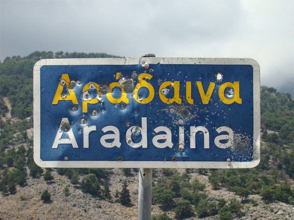 Cretan road sign with ammunition holes