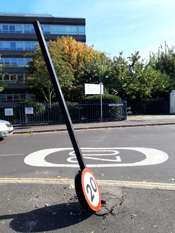 Toppled 20 mph speed limit sign outside DVSA headquarters