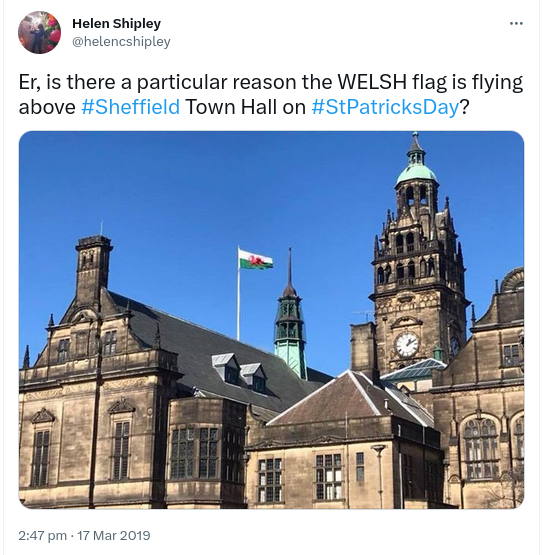 Tweet reads Er, is there a particular reason the WELSH flag is flying
above #Sheffield Town Hall on #StPatricksDay?