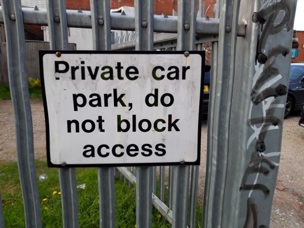 Notice reads Private car park, do not block access