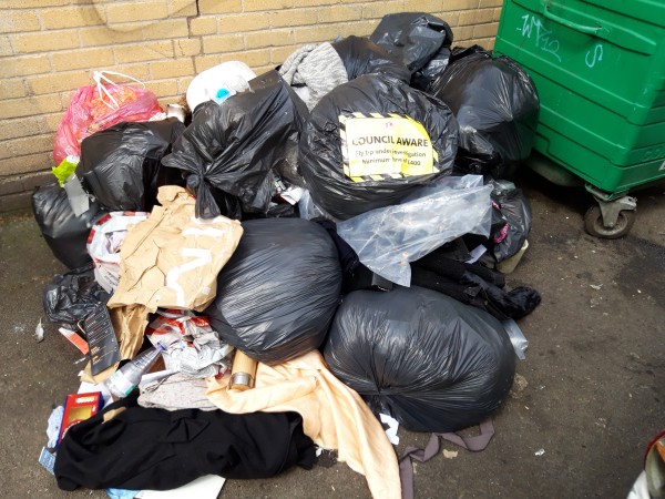 Fly-tipping labelled with enforcement Council Aware sticker
