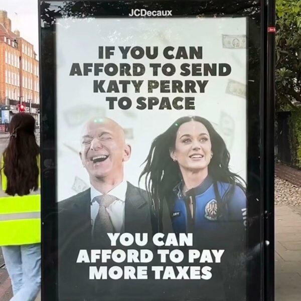 Poster showing Jeff Bezos and Katy Perry with the caption If you can afford to send Katy Perry into space you can afford to pay more taxes