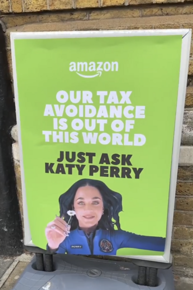 Poster with Amazon logo at head and reading Our tax avoidance is out of this world. Just ask Katy Perry.