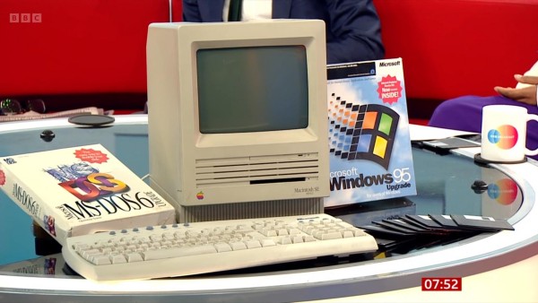Screenshot showing Windows 95 upgrade pack, a pile of floppy disks, MS-DOS 6 installation pack and a Macintosh SE
