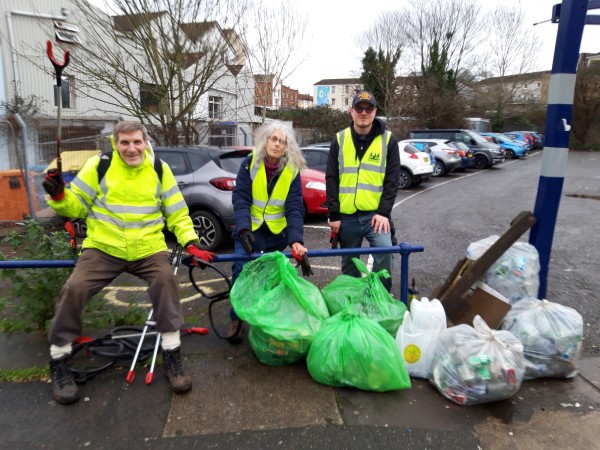 Eric, Ronit and Alex pose with the rubbish removed from Ducie Road car park