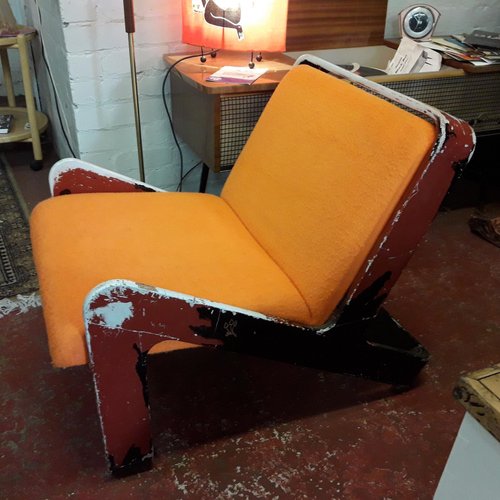 before shot - chipped orange chair